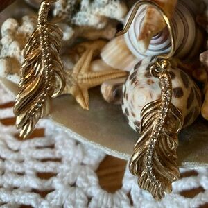 Earrings, Gold Feathers with faux crystals in the center, 1.25” Long